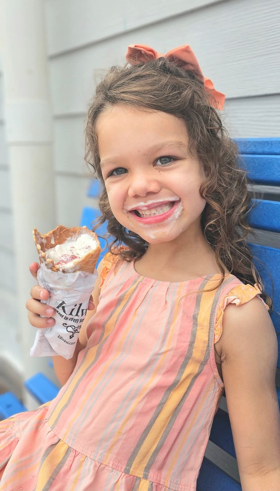 Girl grinning with an ice cream cone